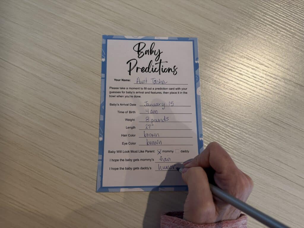 completed baby predictions card for baby shower